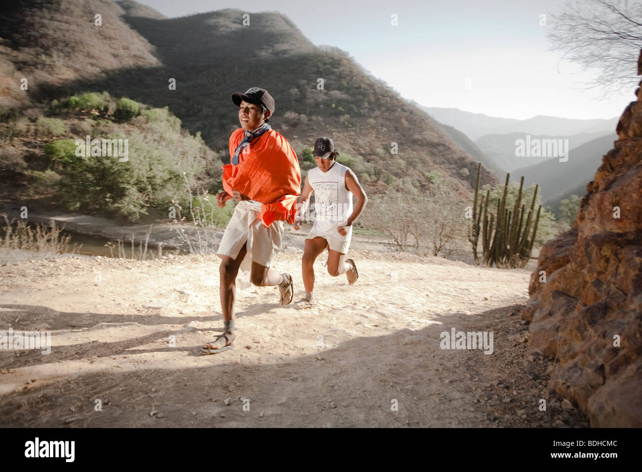 Two Young Tarahumara Runners Running Dressed With Traditional Clothes Stock Photo Alamy