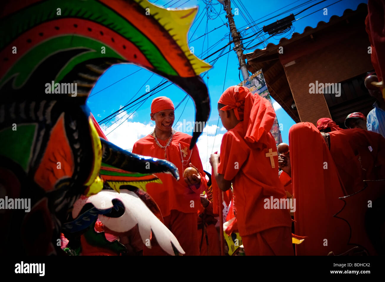 Young men dressed in red costumes celebrate a festival Stock Photo