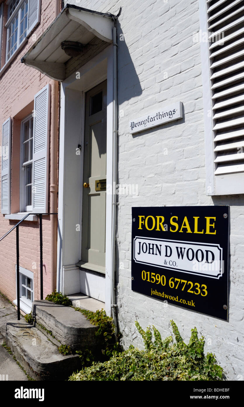 FOR SALE sign outside terraced house in Nelson Place, Lymington