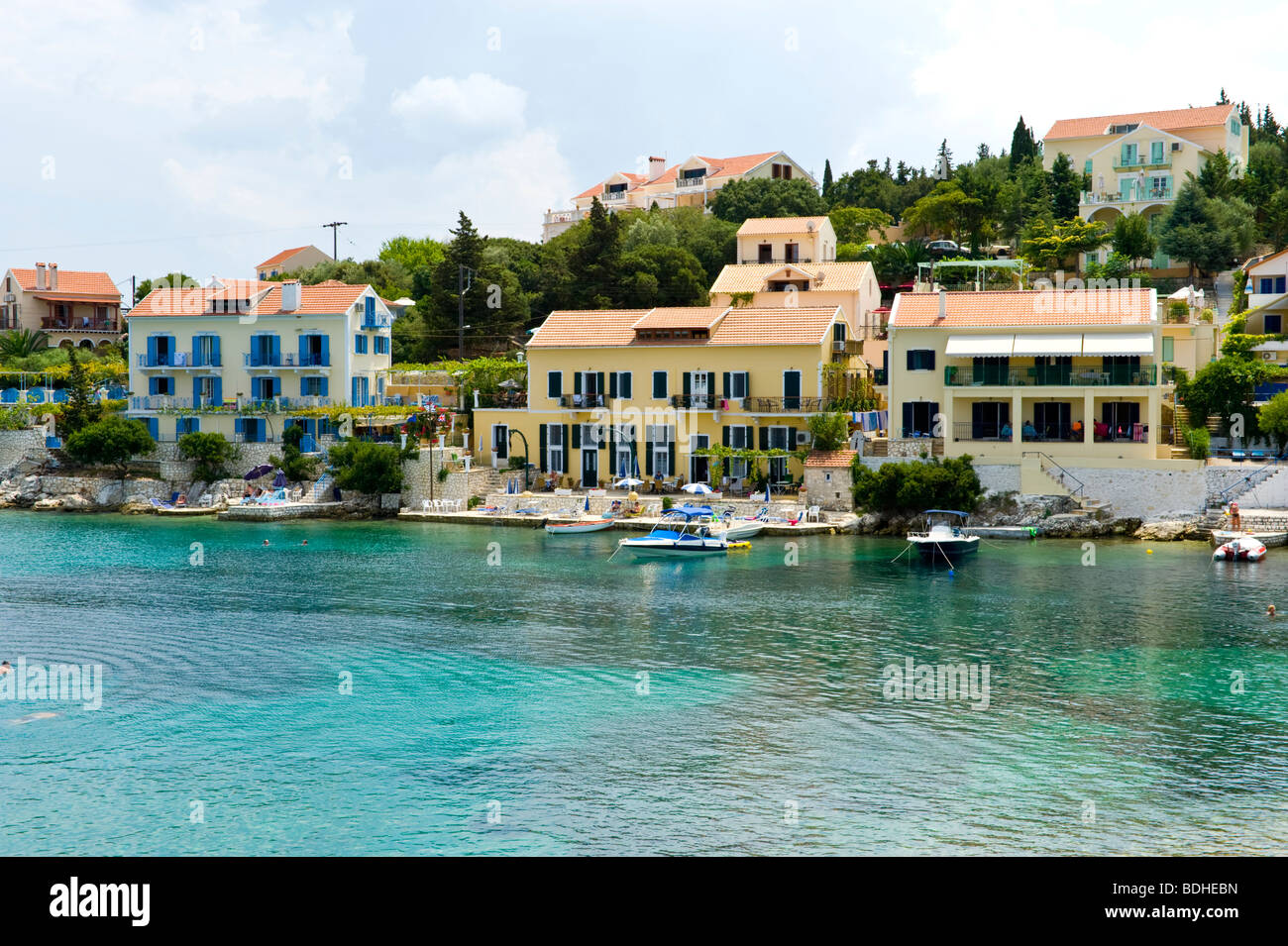 Holiday apartments overlooking the harbour in Fiskardo on the Greek Mediterranean island of Kefalonia Greece GR Stock Photo