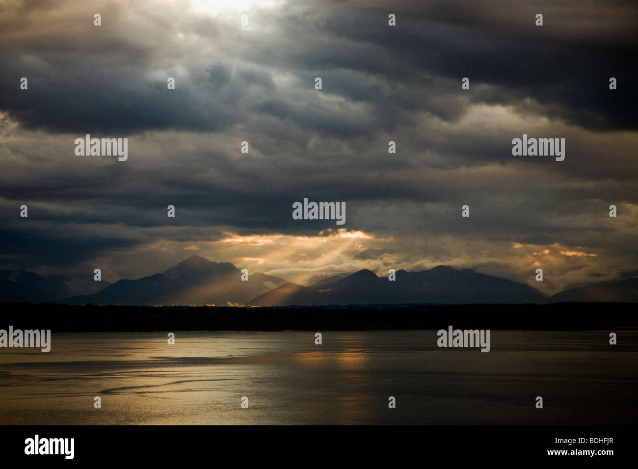 Sun rays through ominous clouds hi-res stock photography and images - Alamy
