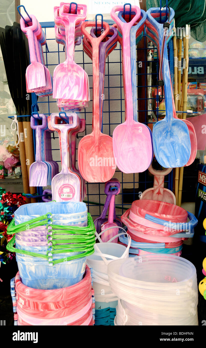 Children's colourful buckets and spades outside a tourist shop Stock Photo