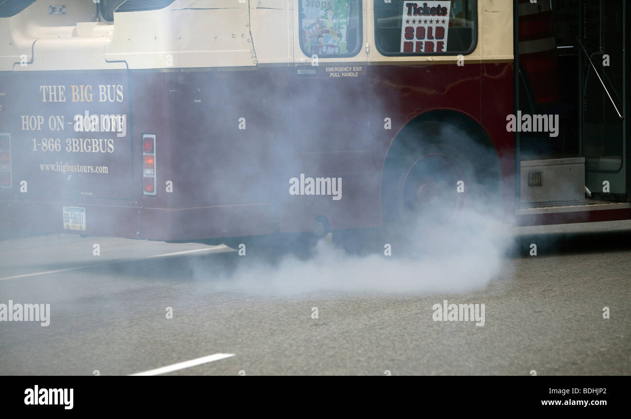 Exhaust fumes emmited by a bus Stock Photo