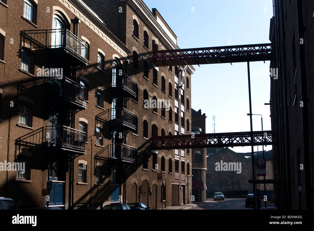 Gantry across the road at a wharf building in Wapping in the East End of London. These were once working wharves. Stock Photo
