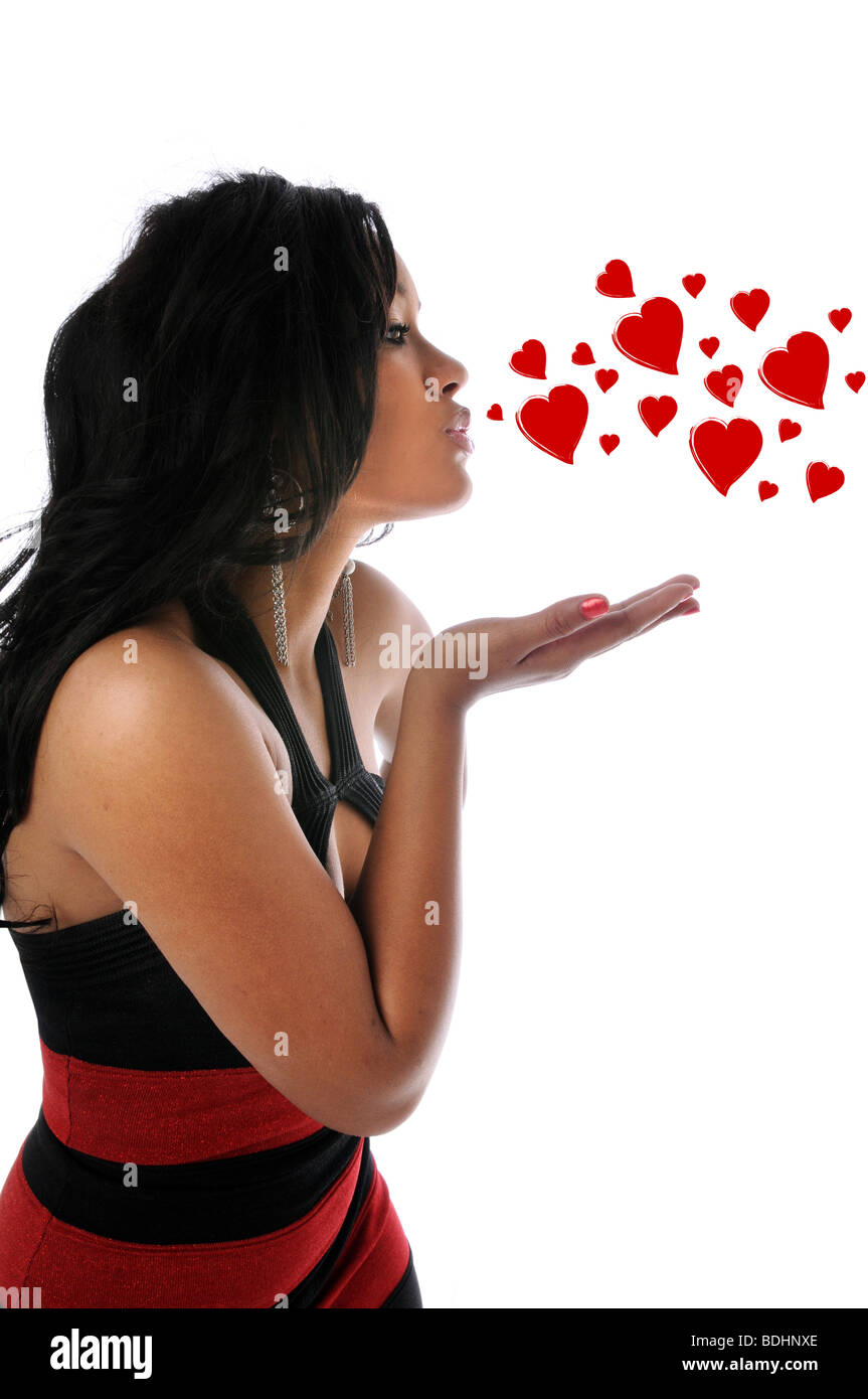 Young beautiful woman blowing kisses isolated over a white background Stock Photo
