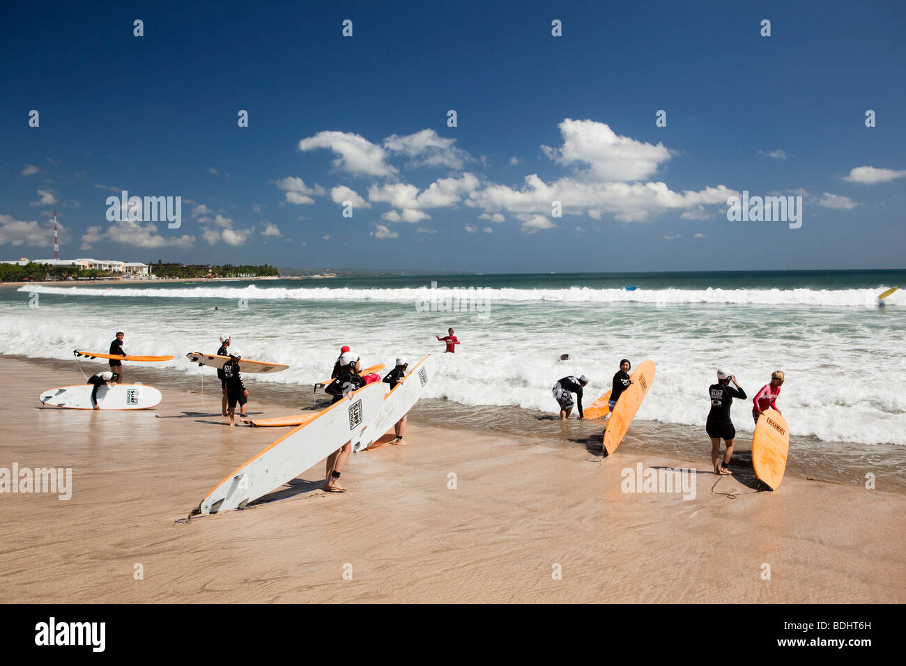 Indonesia, Bali, Kuta, beach, Odysseys surf school students learning to surf  at waters edge Stock Photo - Alamy