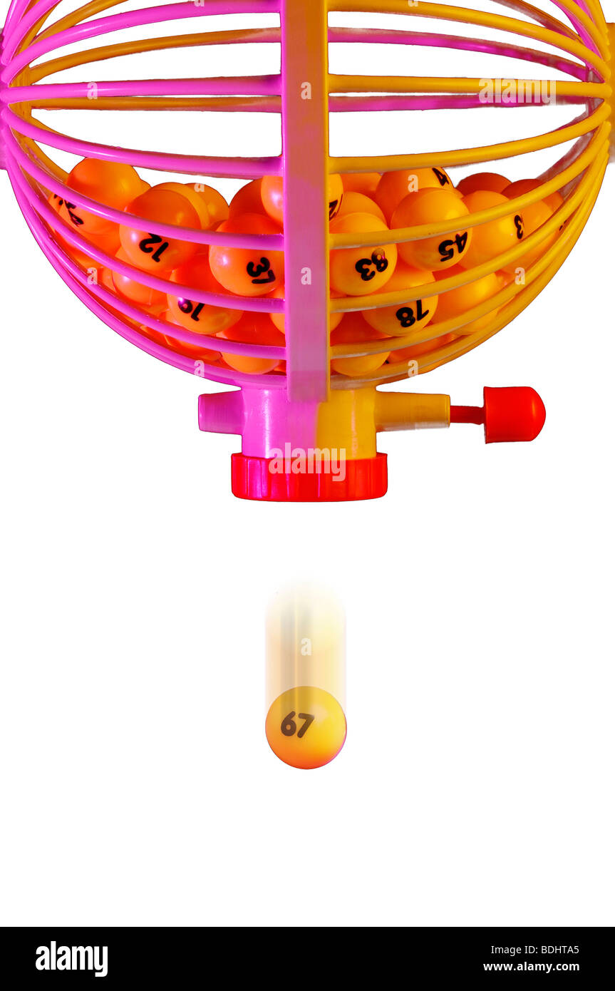 Bingo balls in cage with one dropping Stock Photo Alamy