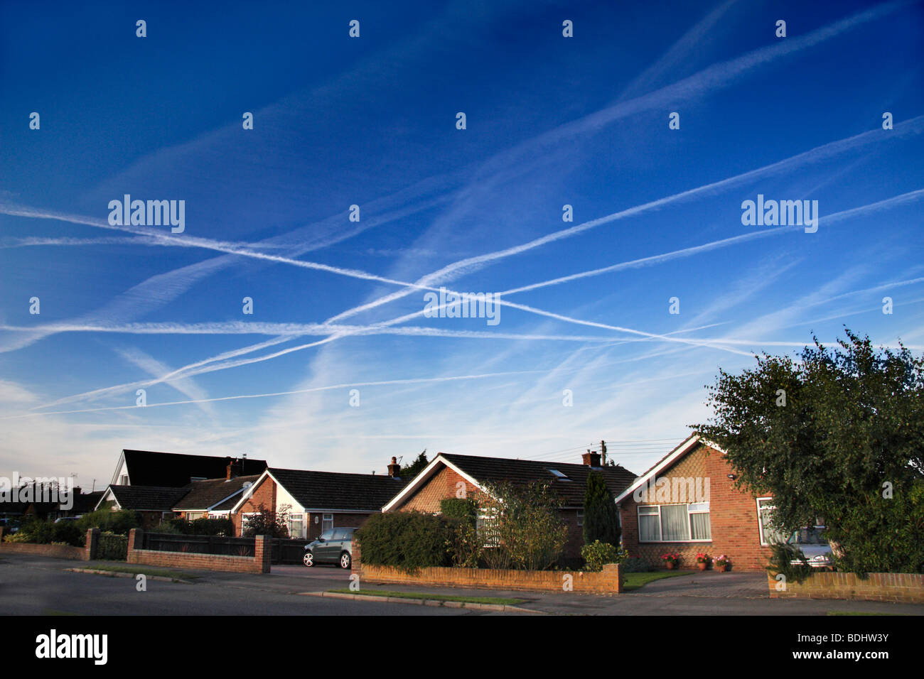 Late summer afternoon sky full of contrails- Radley Oxfordshire 2 Stock Photo