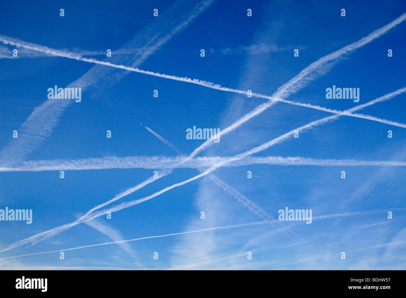 Late summer afternoon sky full of contrails- Radley Oxfordshire Stock Photo