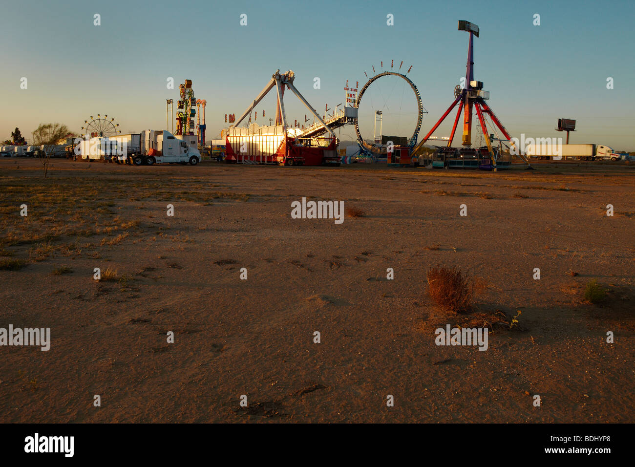 Fairground in a desert at sunset Stock Photo