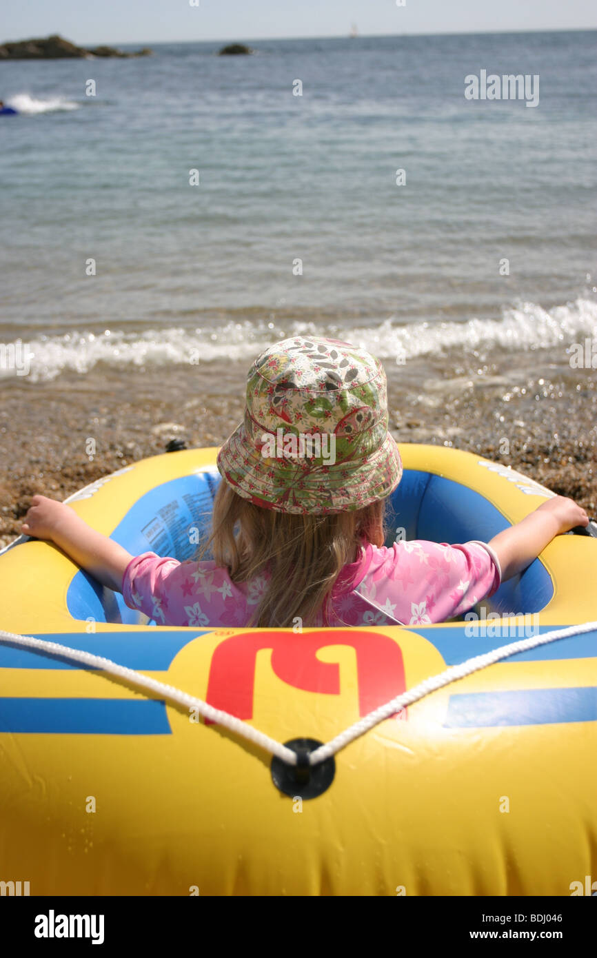 Young girl in a Dinghy at 'Man o' War' Bay, Dorset Stock Photo Alamy
