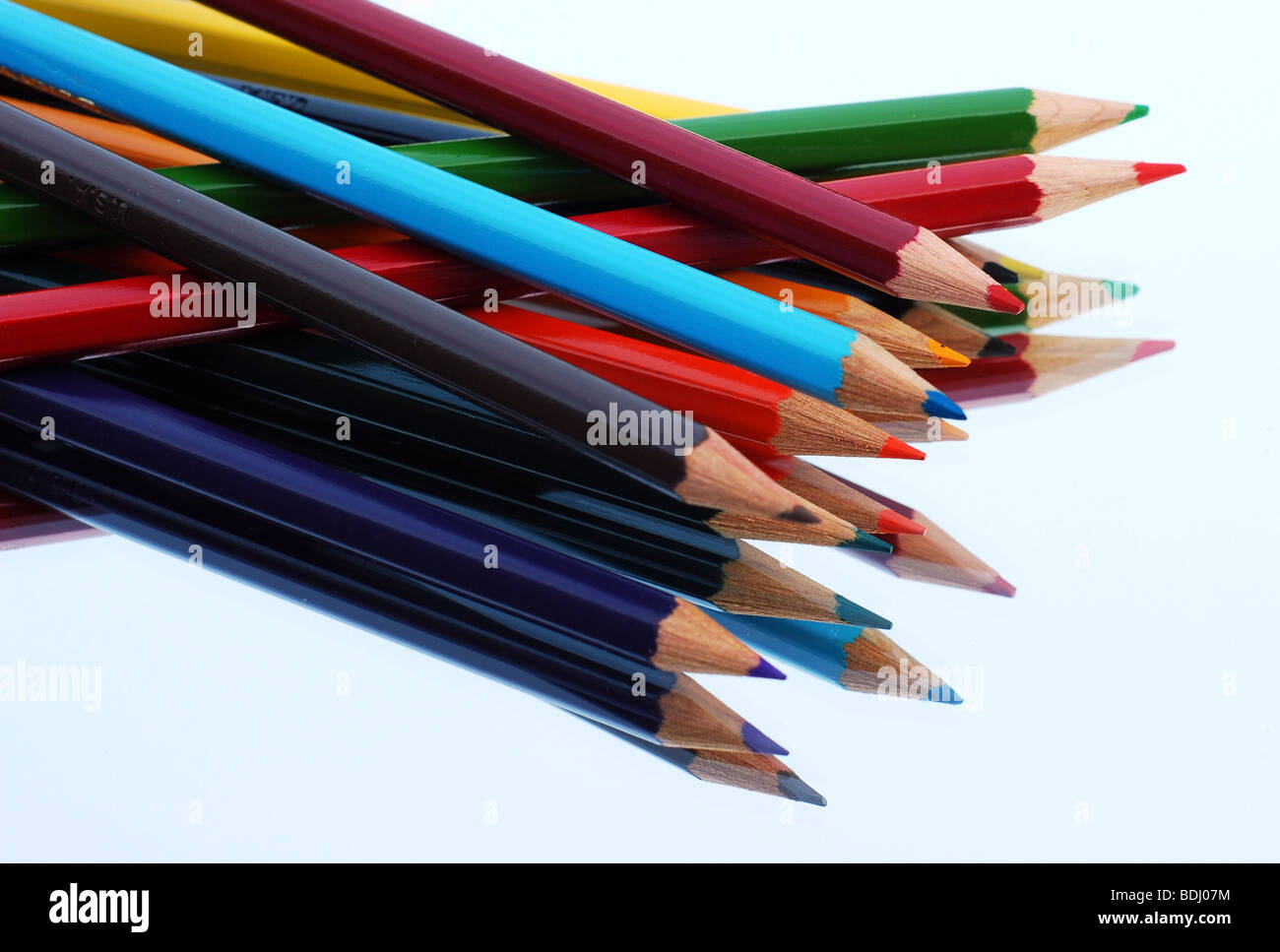 Crayons or coloured pencils reflected Stock Photo