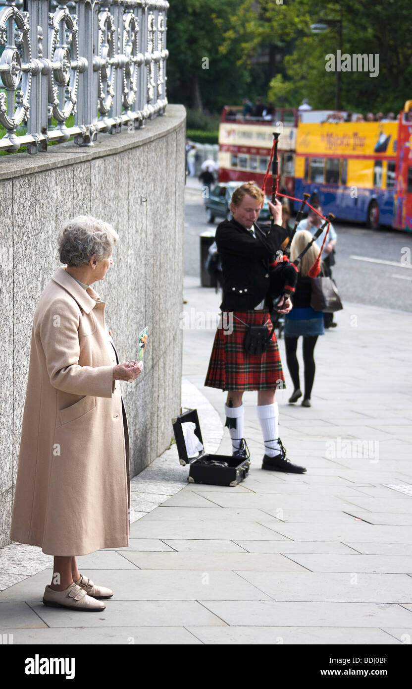 Volunteer selling her charity  ( homeless animals) Edinburgh.Scotland. Stock Photo