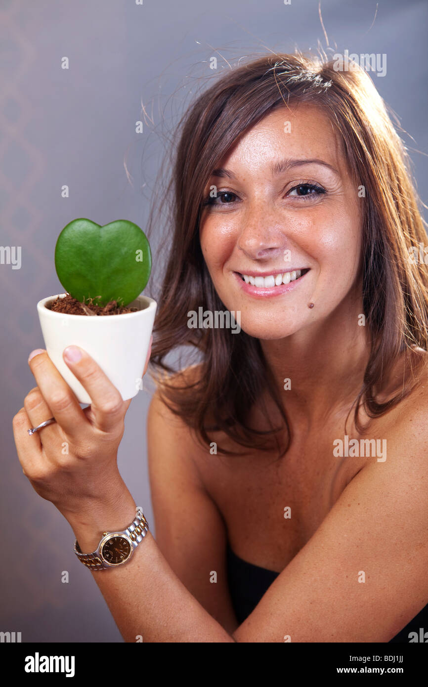 Woman plant pot holding hi-res stock photography and images - Alamy