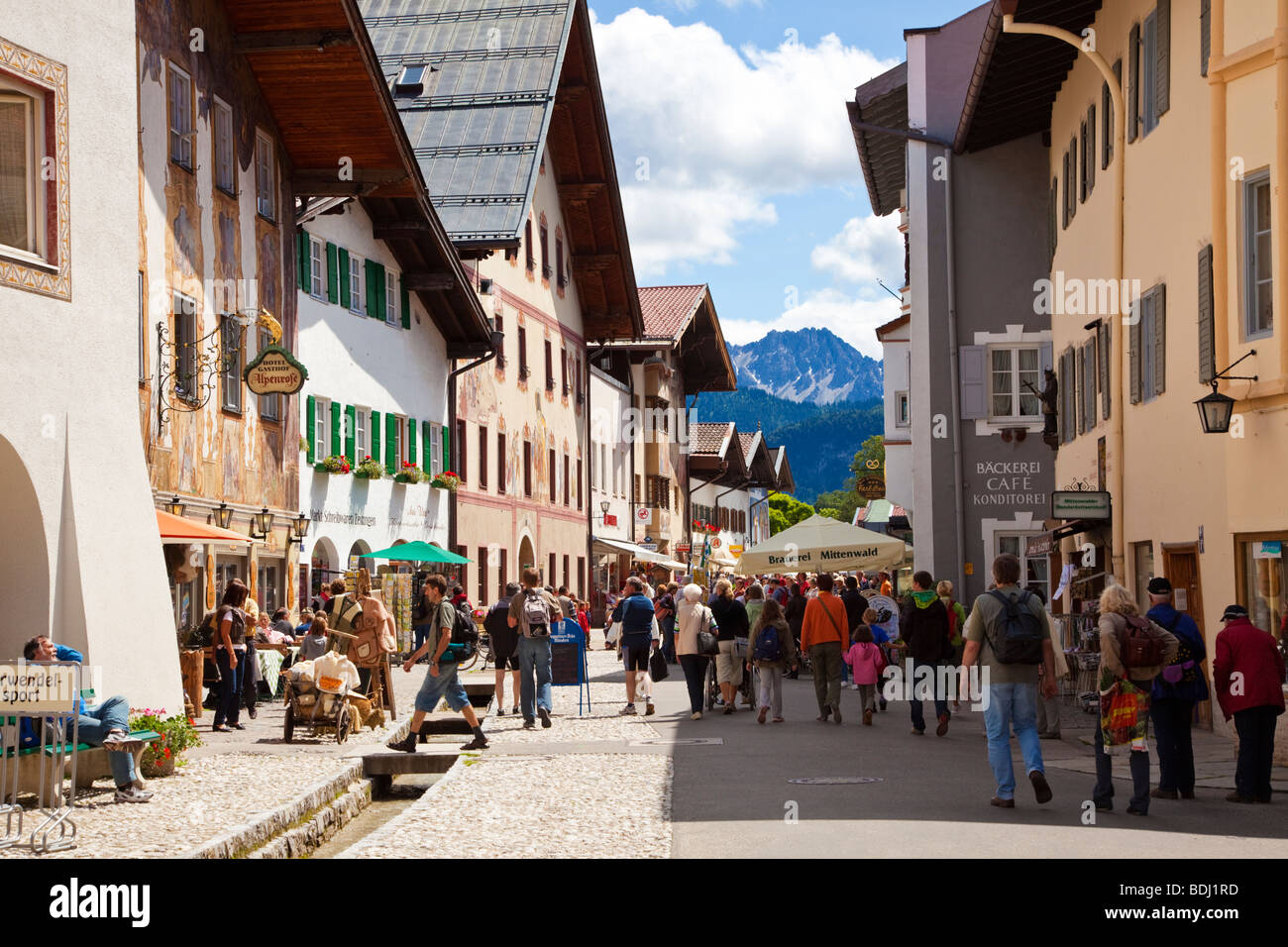 Germany, town centre of Mittenwald with people and the Karwendel ...
