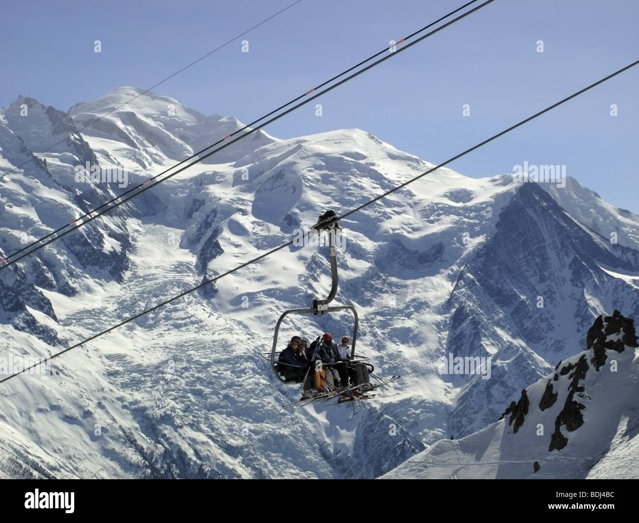 Skiers on chair lift. Stock Photo
