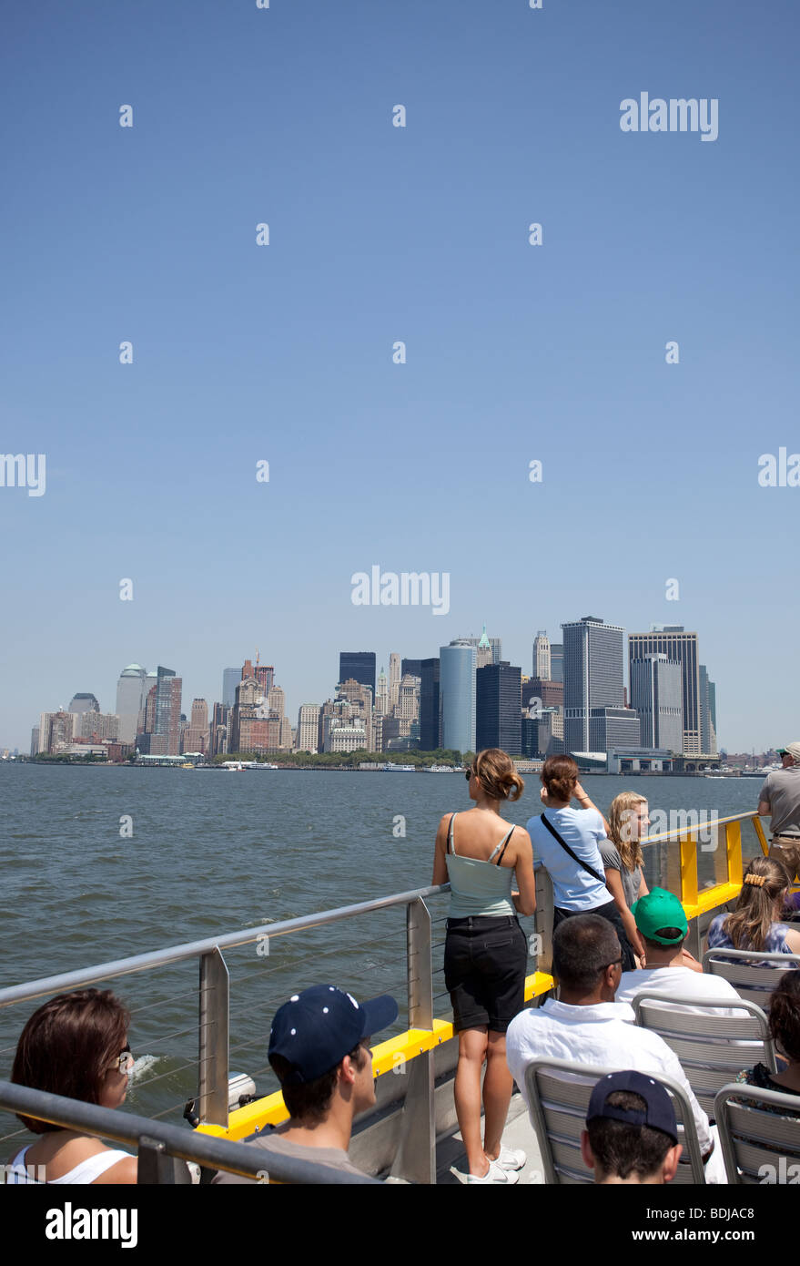 A group of tourist contemplating Manhattan from a water taxi, Hudson River,  New York City, USA, North America. Stock Photo