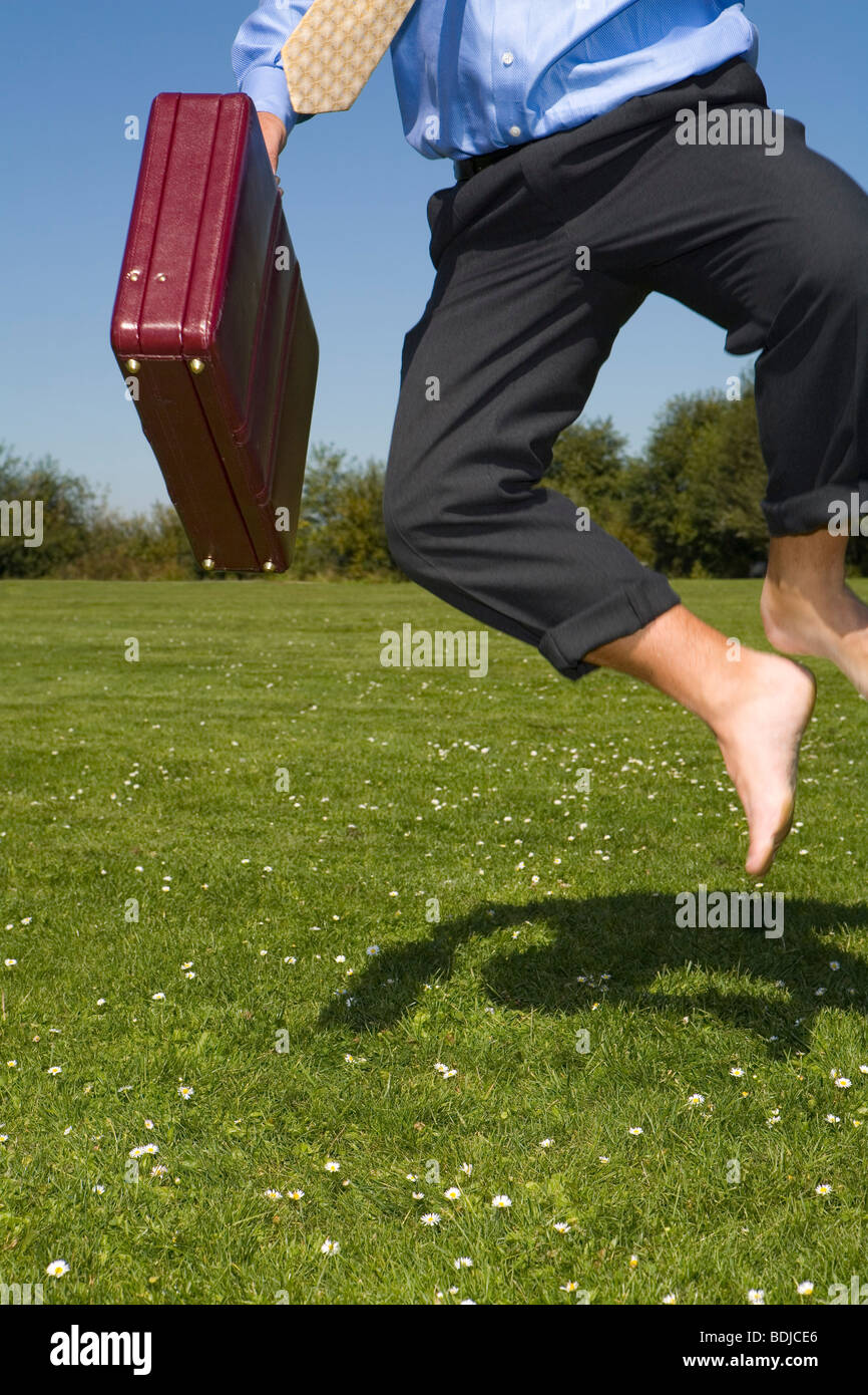 Businessman Clicking His Heels Stock Photo Alamy