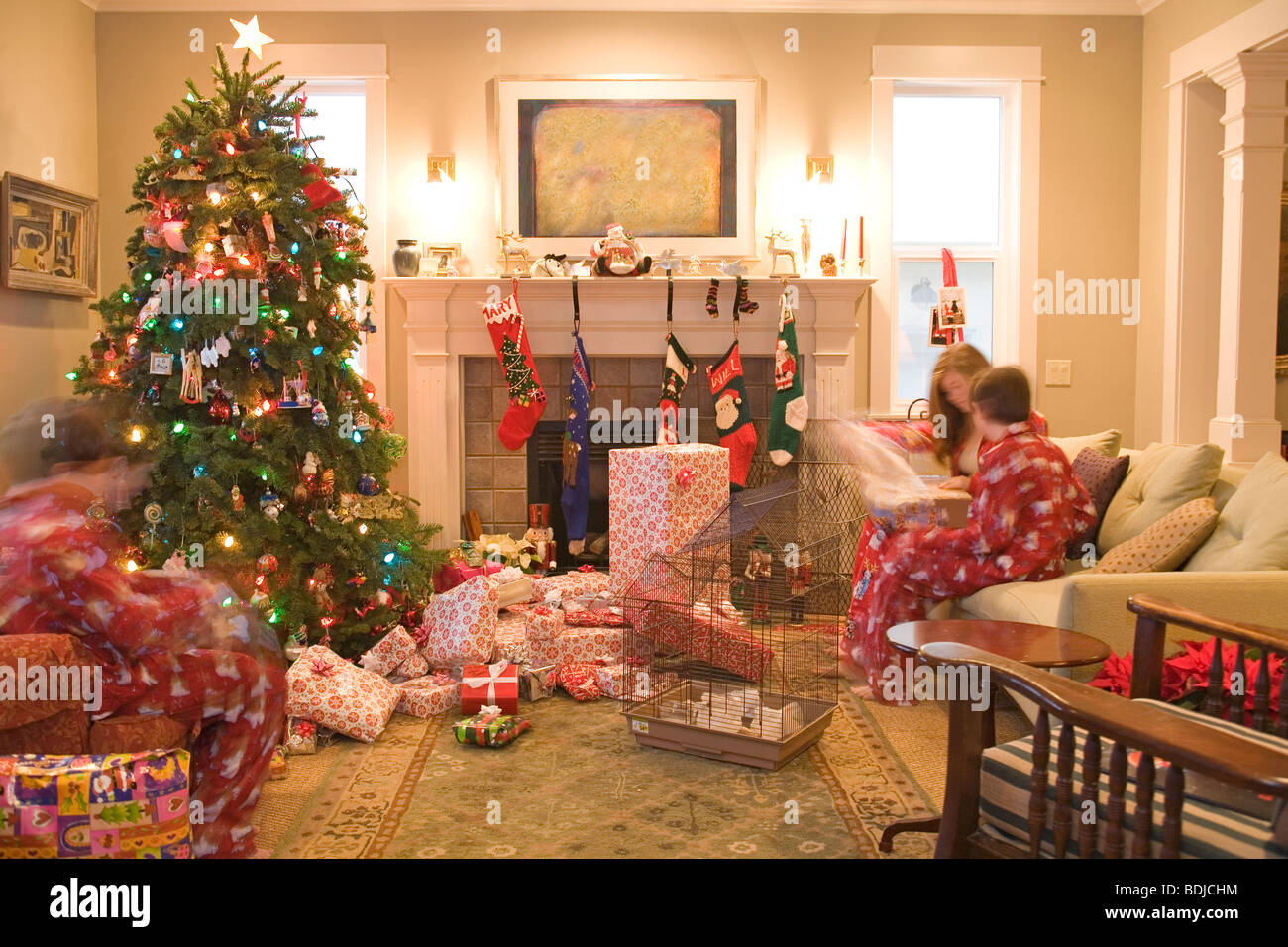 Kids Opening Presents on Christmas Morning Stock Photo