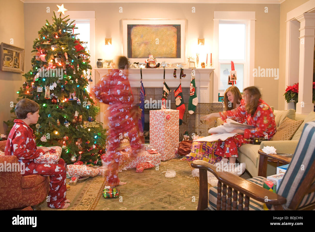 Family Opening Presents on Christmas Morning Stock Photo