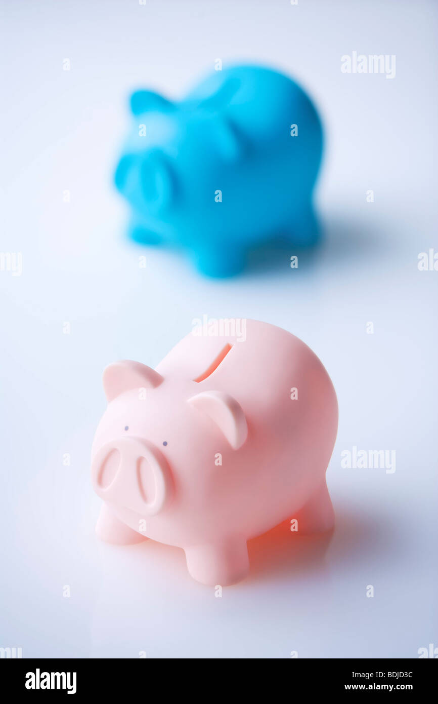 Comparing two piggy banks hires stock photography and images Alamy