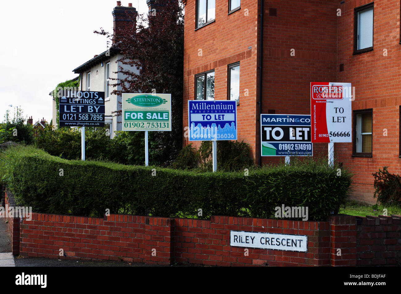For sale and to let signs outside an apartment block in the UK Stock Photo