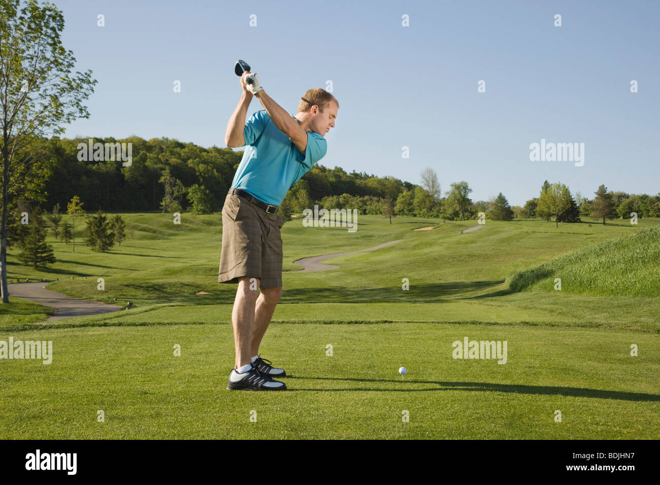 Man Golfing Stock Photo - Alamy