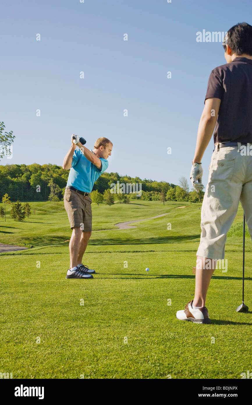 Men Playing Golf Stock Photo