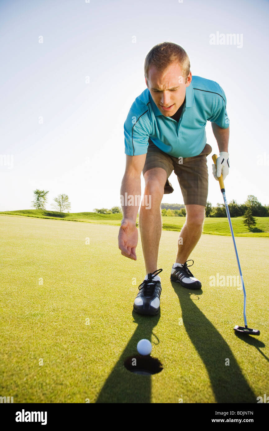 Man Playing Golf Stock Photo