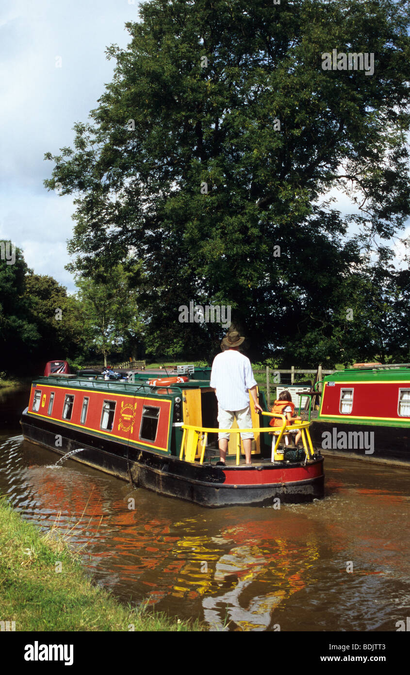 Young Family On Boating Holiday On The Trent And Mersey Near Rode Heath In Cheshire Stock Photo