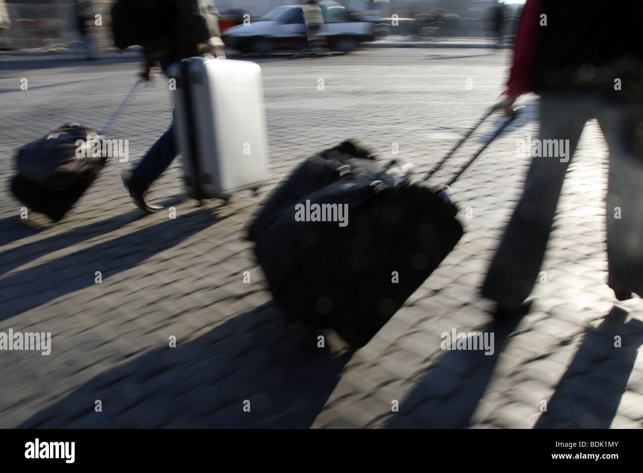 people with luggage in street in city town Stock Photo Alamy