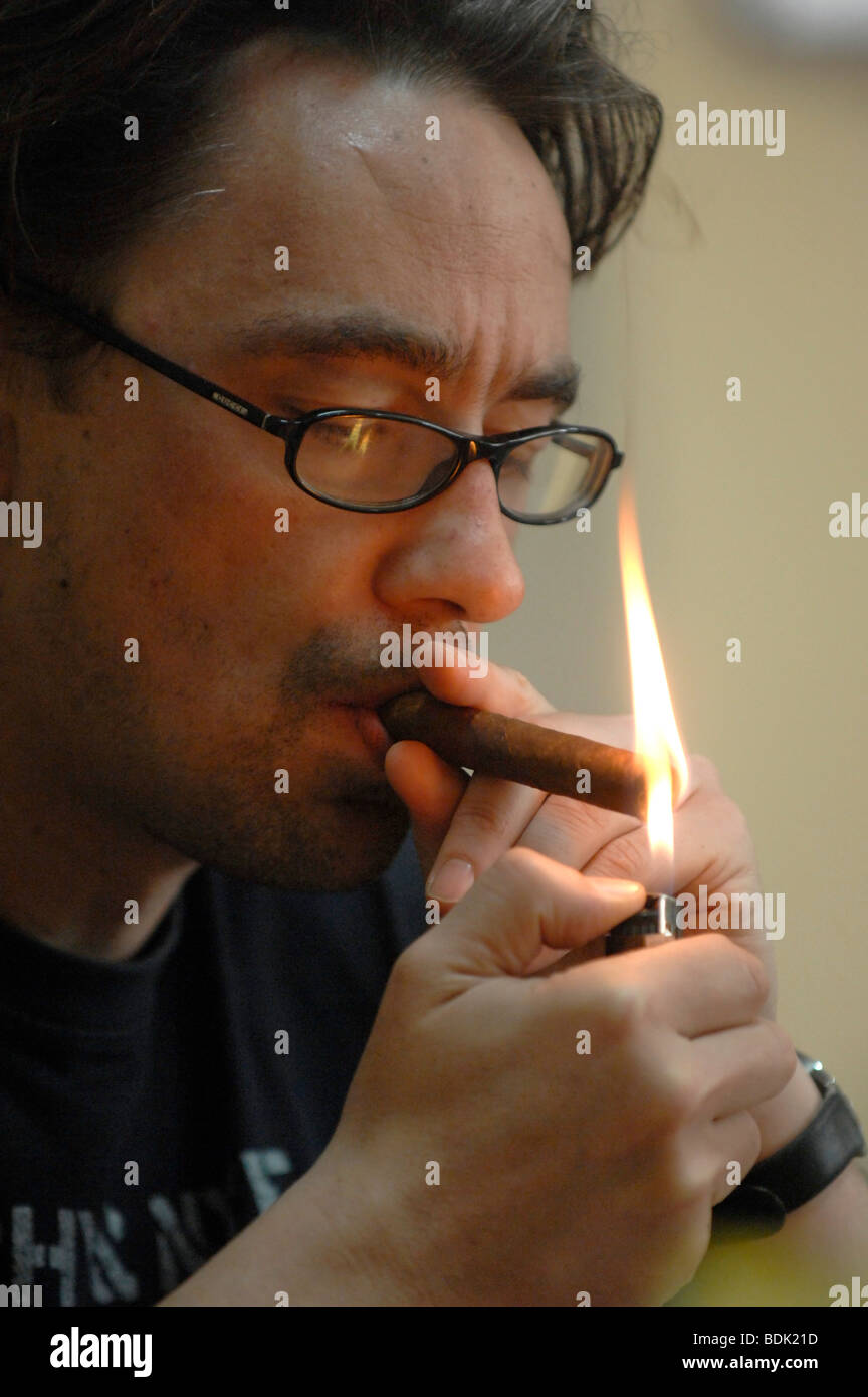 Lighting a Cuban cigar Stock Photo Alamy
