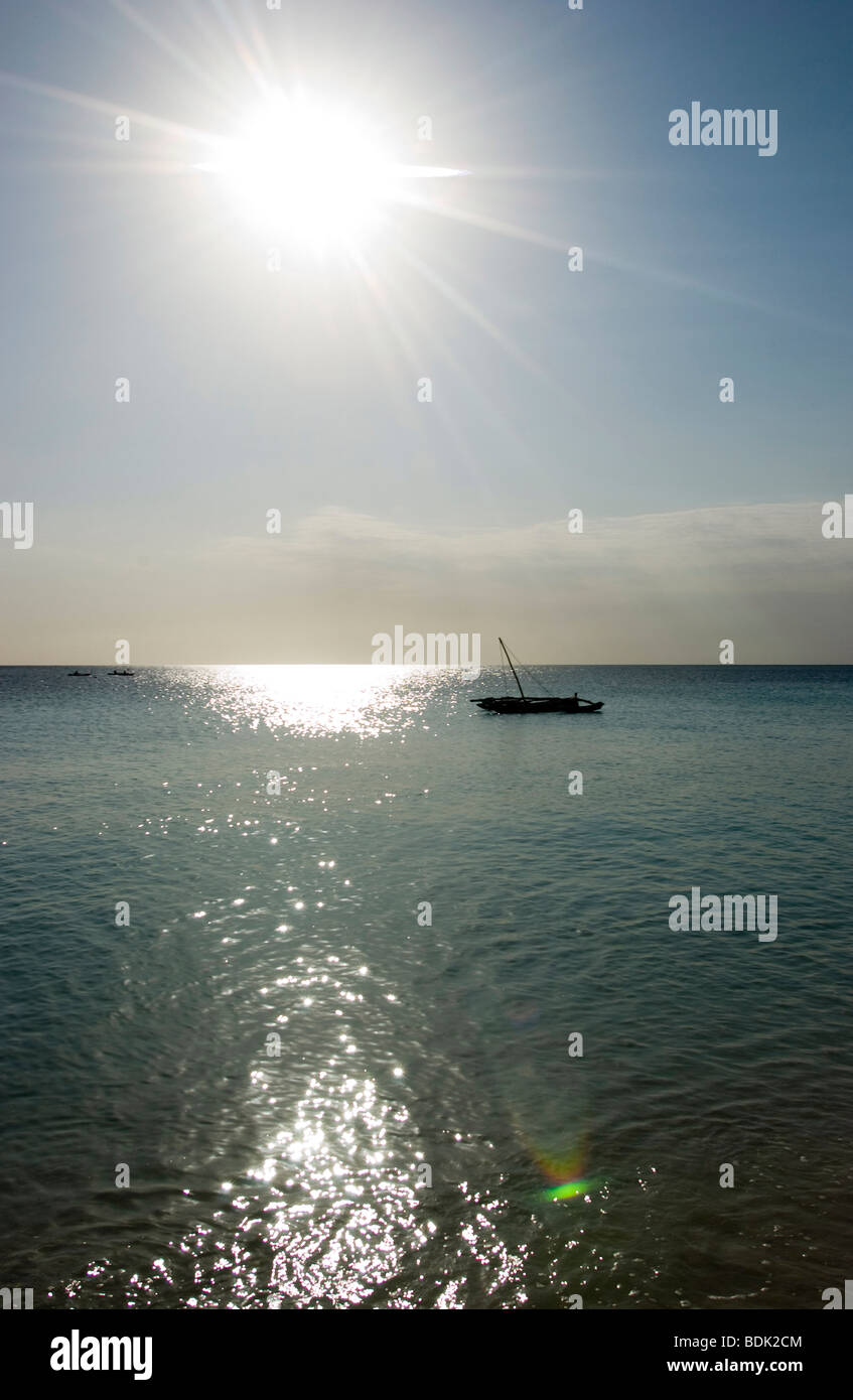 Fishing boat at sunset Stock Photo - Alamy