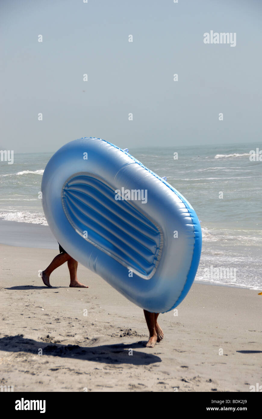 Walking air mattress on the beach Stock Photo Alamy