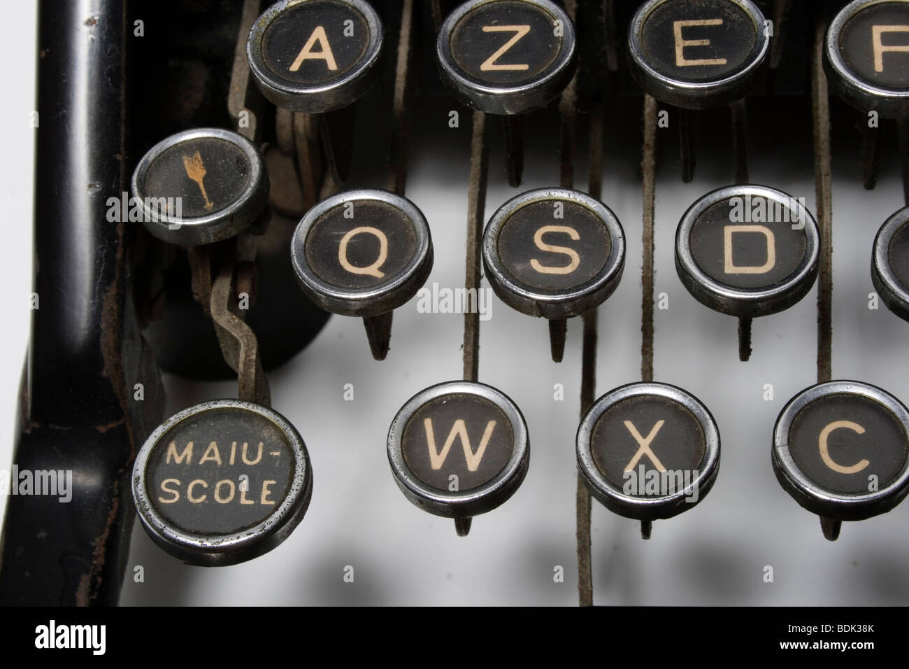 black key with gold letters of a old famous typewriter, capital letter