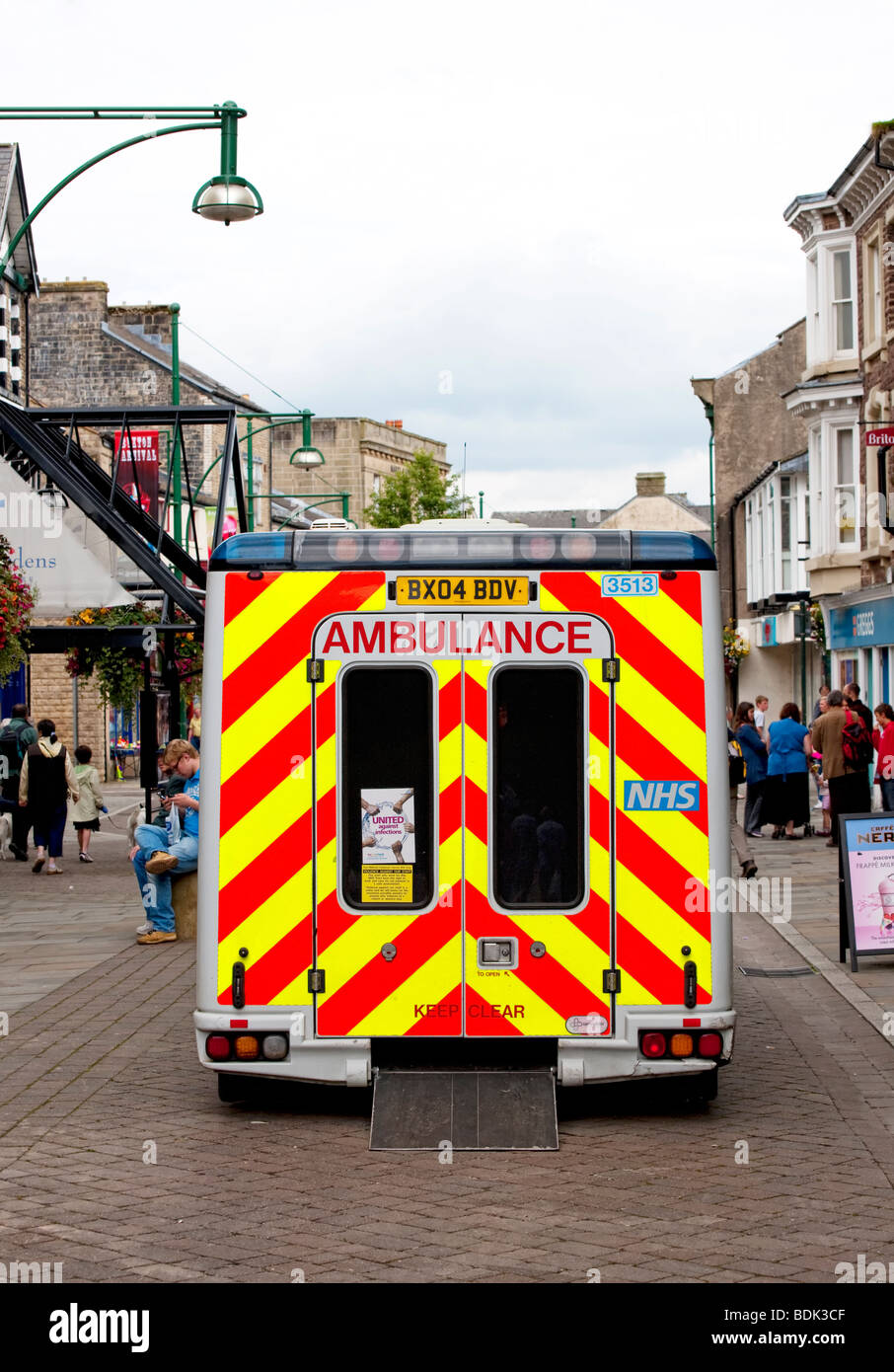 Back view of Ambulance parked in a pedestrian precinct in Buxton, Derbyshire Stock Photo