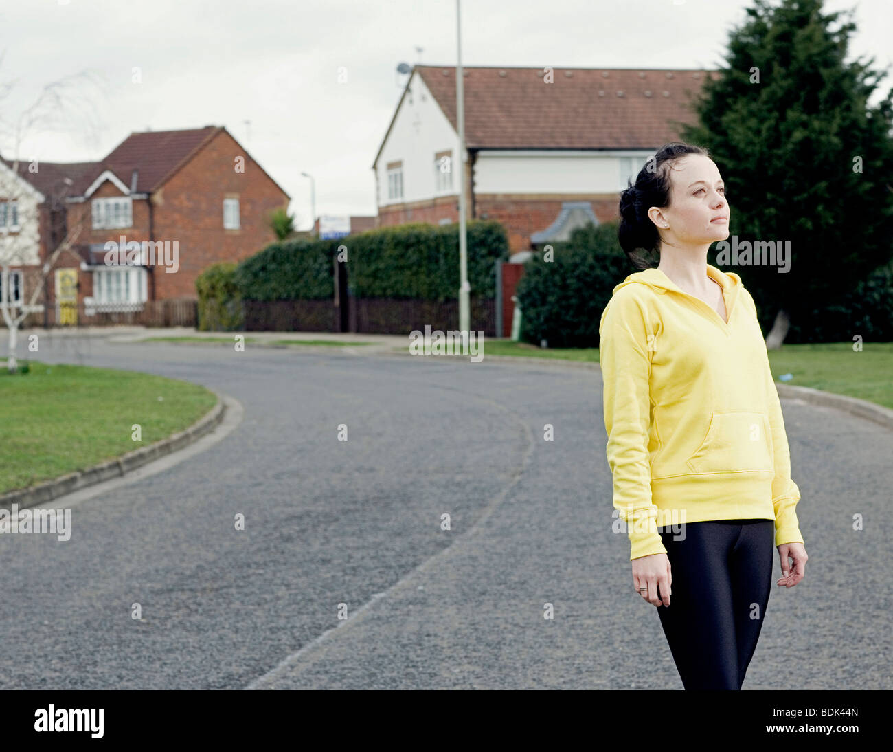 jogging looking up after run, satisfied with herself Stock Photo - Alamy