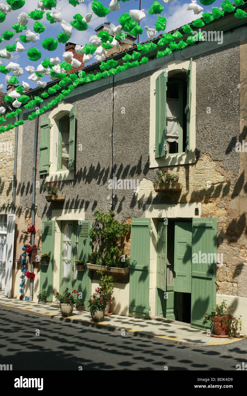 Colourful street decorations during the summer Felibree in the Bastide of Beaumont, France Stock Photo