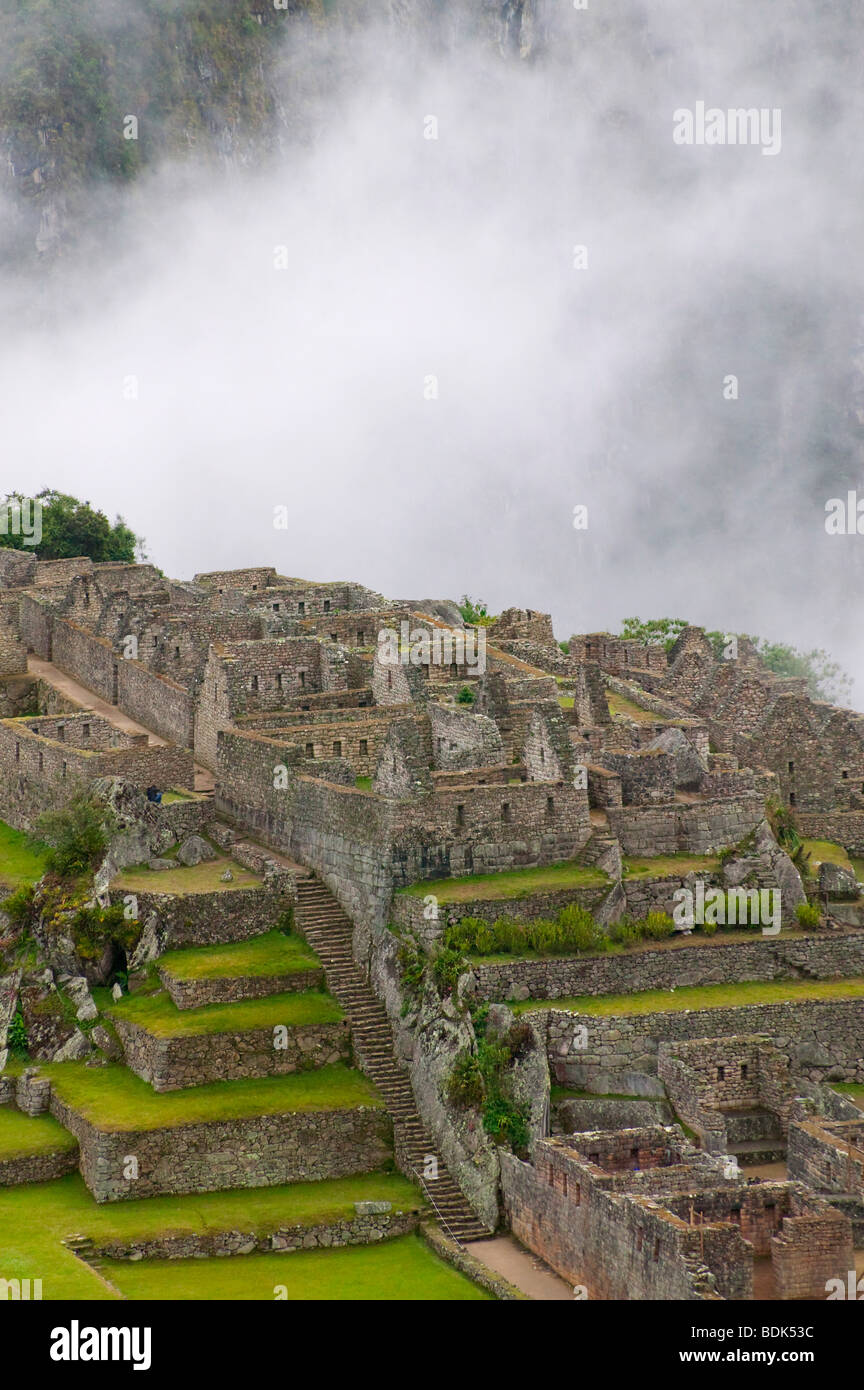 Ancient ruins of Machu Picchu in the Andes Mountain in early morning ...