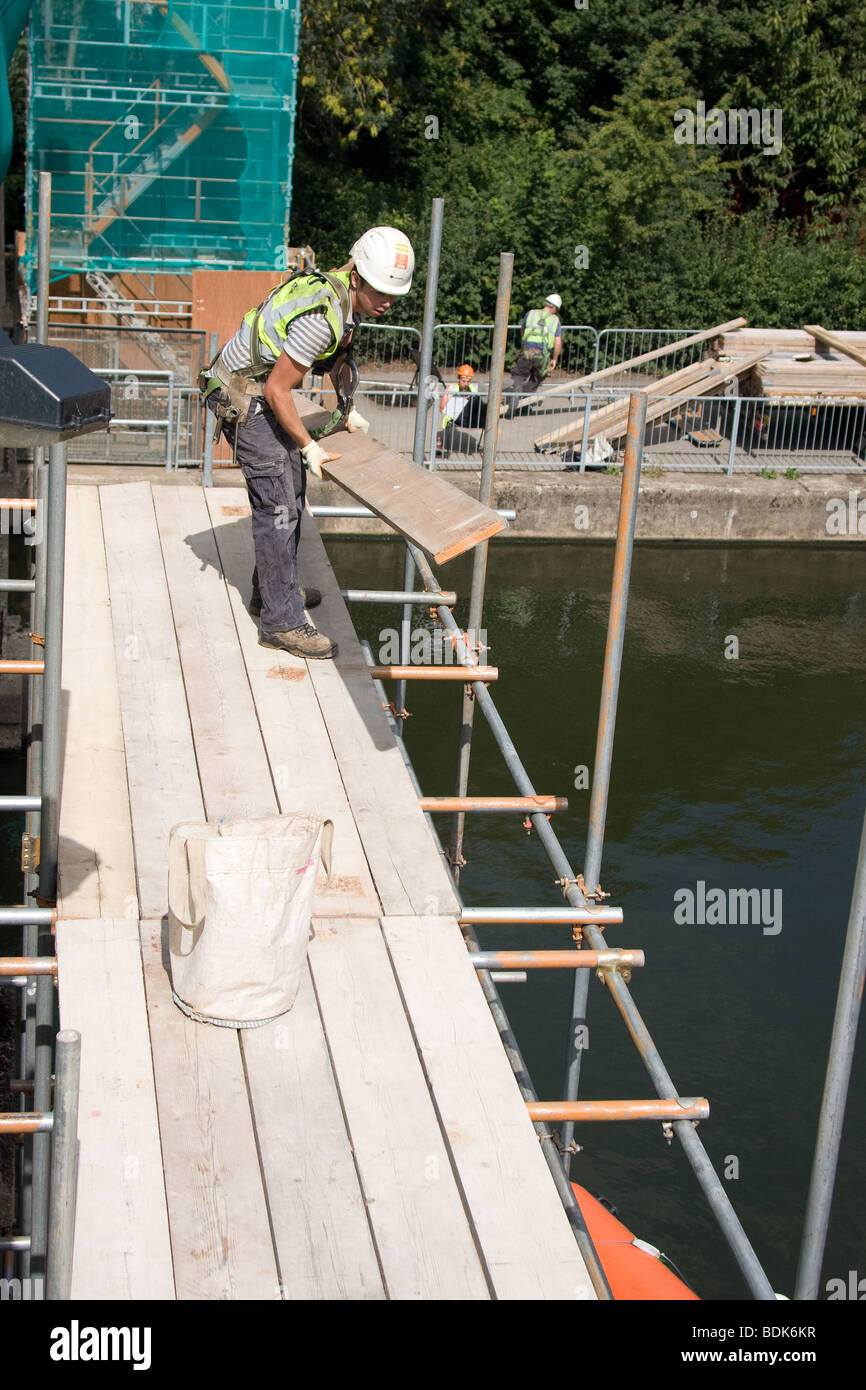 building scaffold scaffolding site construction rig workers Stock Photo