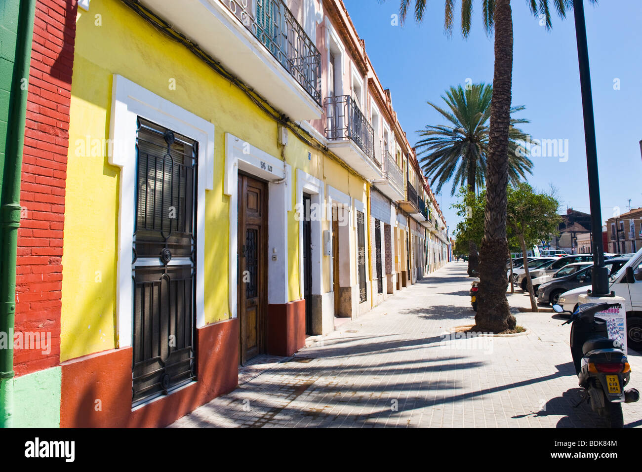 Spain , Valencia , Eugenia Vines , typical traditional street , old terraced houses by beach painted in bright colours or colors Stock Photo