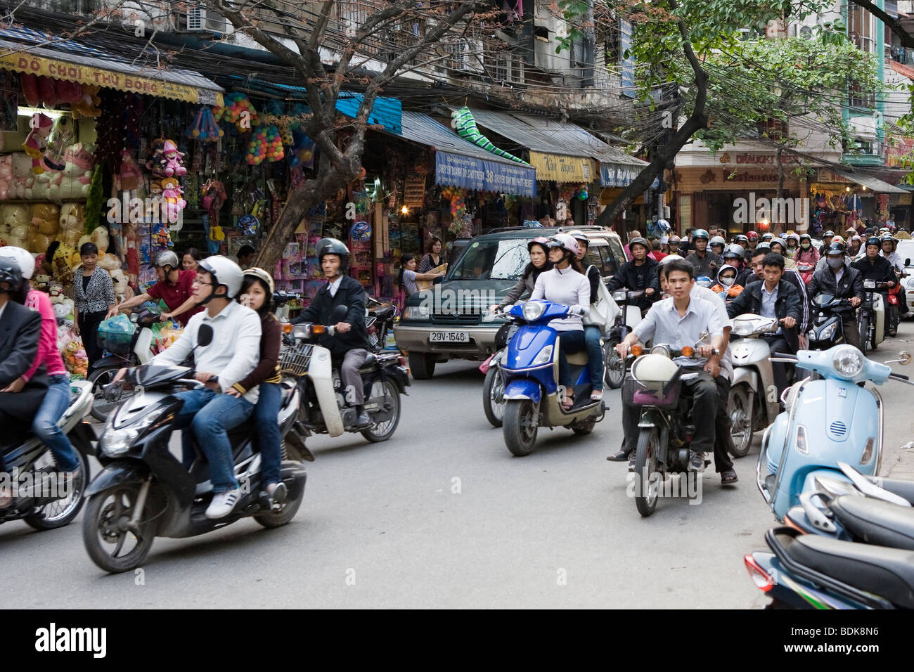 People riding scooters/mopeds in Vietnam in Hanoi Stock Photo Alamy