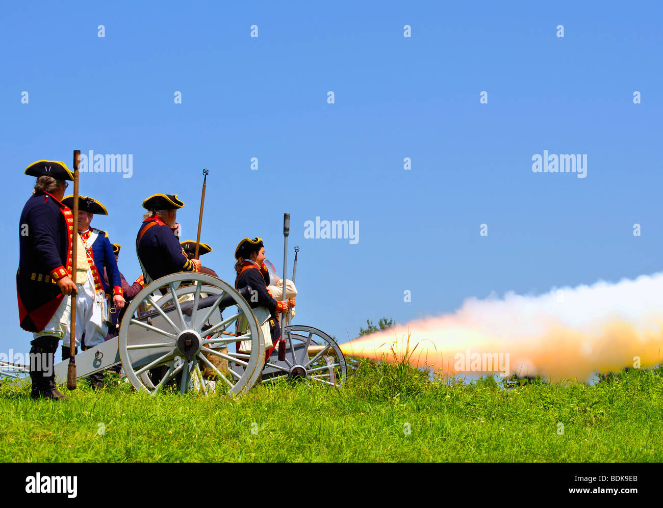 American Patriots firing cannon Stock Photo