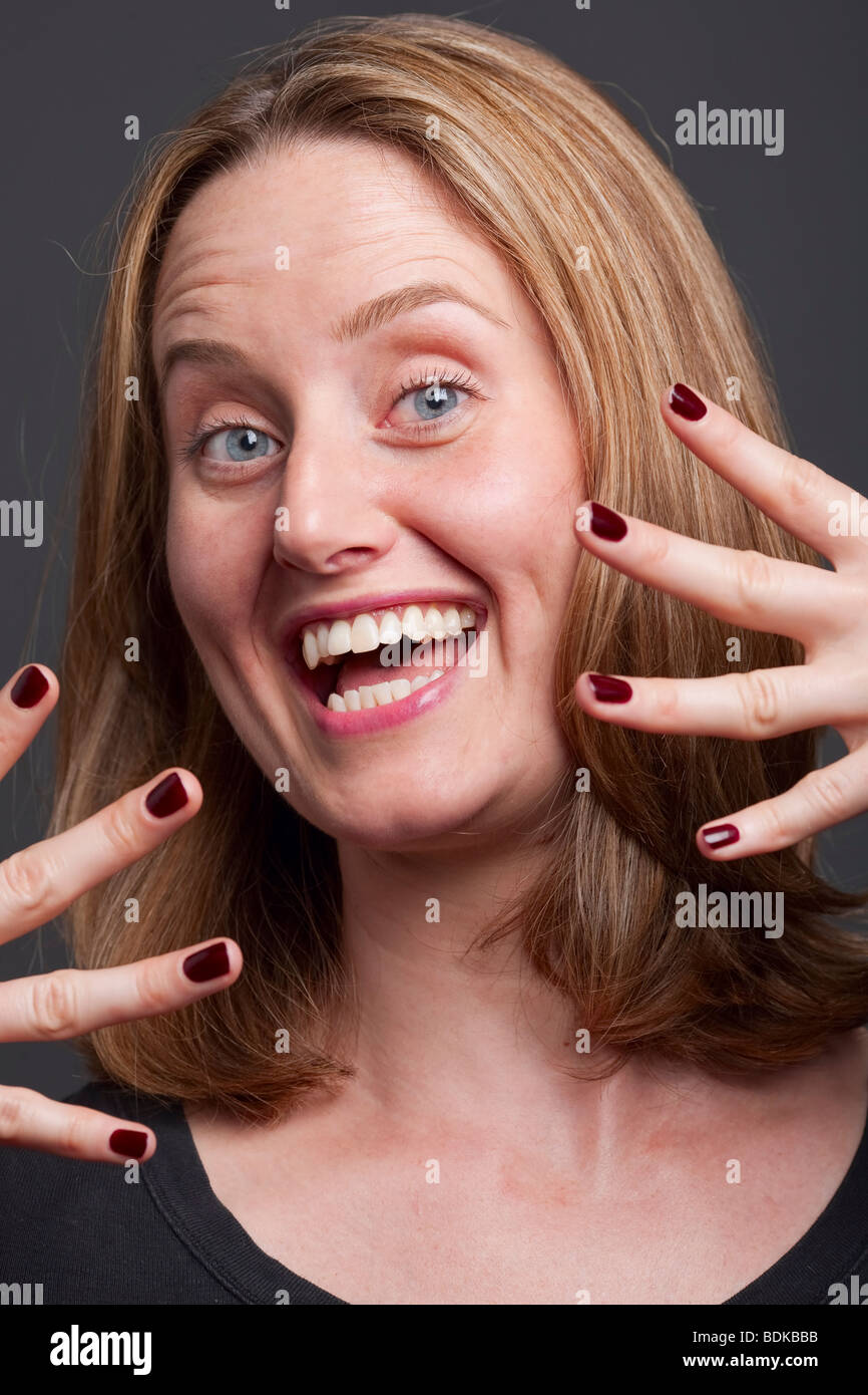 Woman improvises using her jazz hands Stock Photo