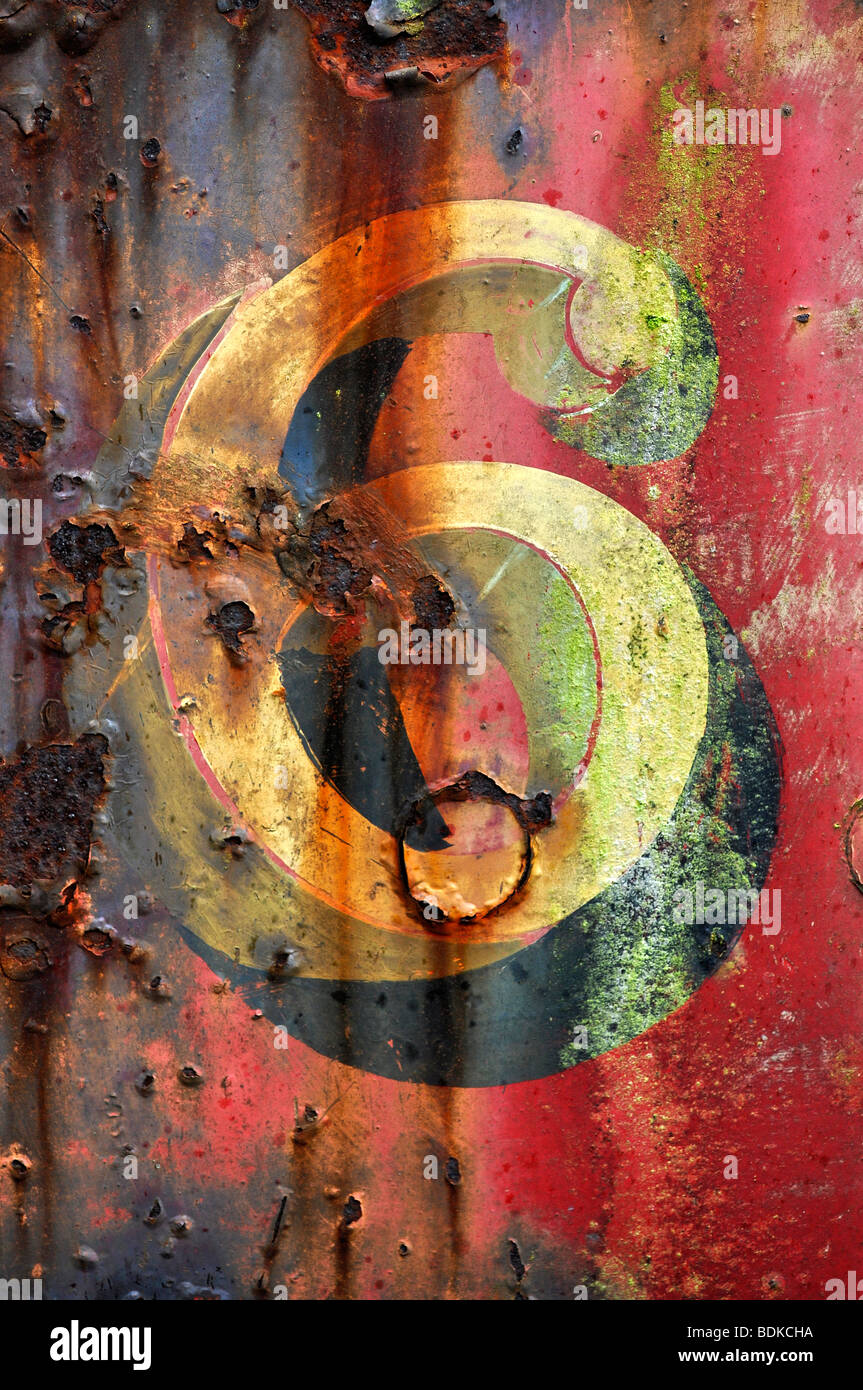 number six 6 old painted railway train number red yellow steam rust metal Stock Photo