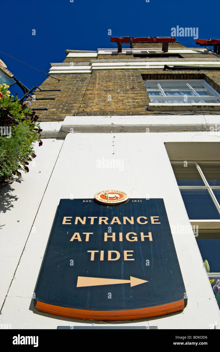 entrance at high tide sign at the white cross pub and hotel, richmond