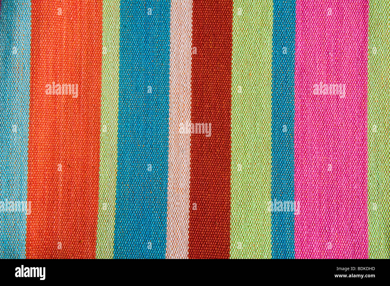 Colourful stripey cotton fabric - reminiscent of canvas for deckchairs. Stock Photo