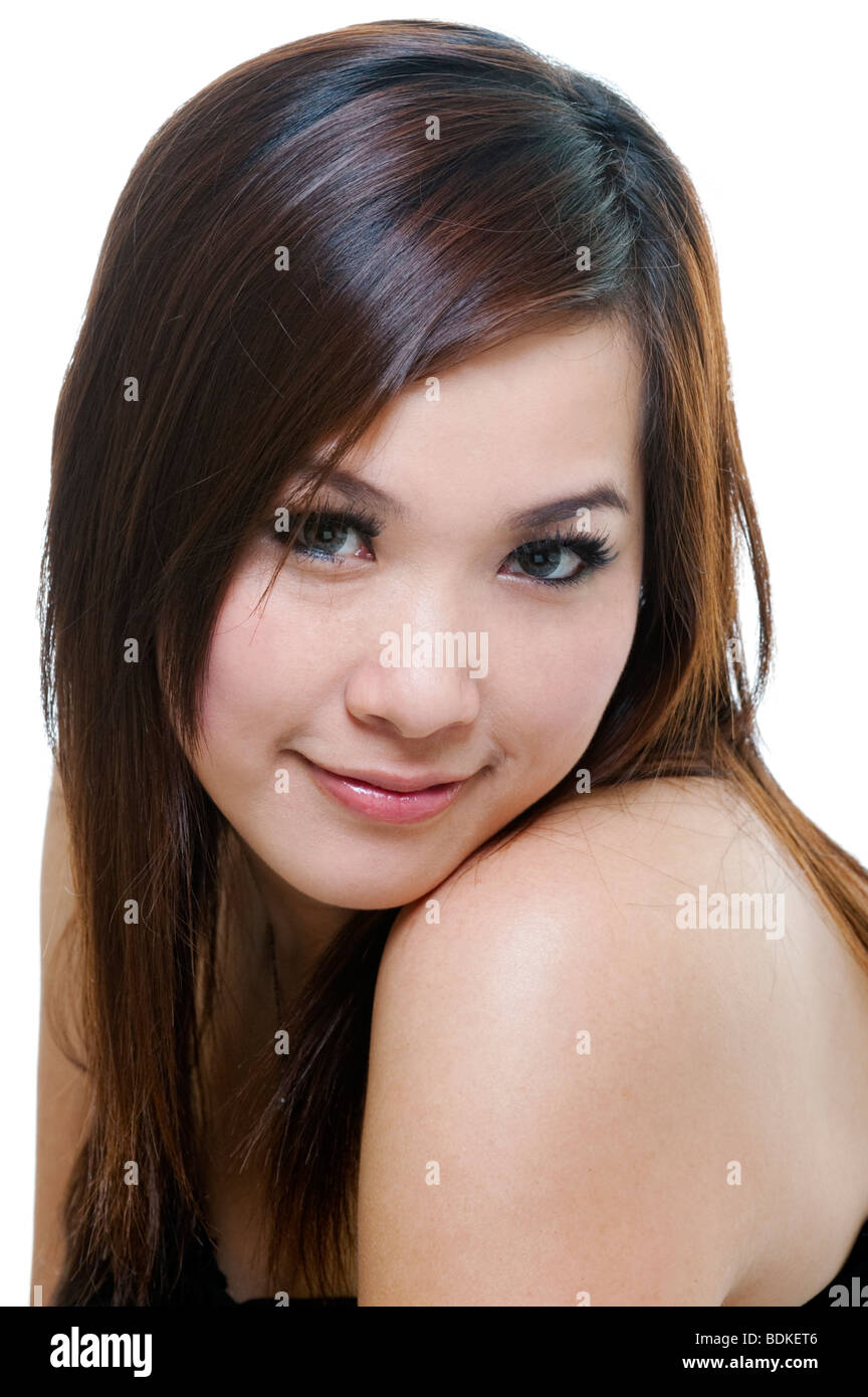 Asian Woman Looking at Camera Head and Shoulders Portrait Studio Shot Stock Photo