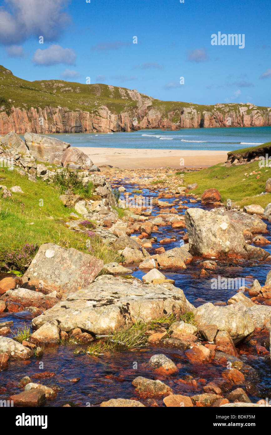 River running down to the beach at Traigh Allt Chailigeag, Sutherland, Scotland Stock Photo