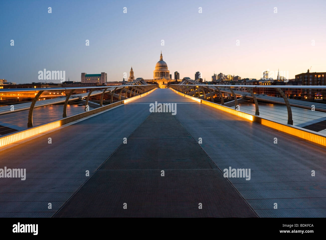 Millennium Bridge in London with St Paul's Cathedral in the background and early sunrise light Stock Photo